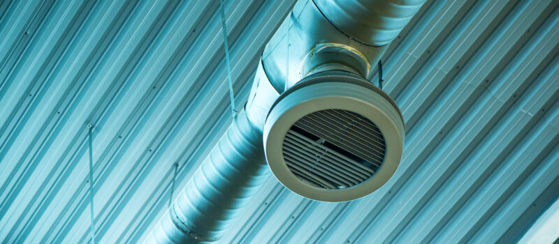 Industrial ventilation system pipes on warehouse ceiling